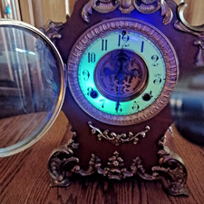 Antique Victorian Black Enameled Iron Mantel Clock with Ram's Head Ornaments and Copper Dial — listing 4