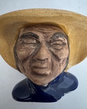 Ceramic Figurine of a Seated Barefoot Man Holding an Apple — listing 3