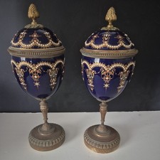 Pair of Antique-Style French Porcelain Covered Urns with Gilt Griffin Handles and Ormolu Bases