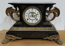 Antique Victorian Black Enameled Iron Mantel Clock with Ram's Head Ornaments and Copper Dial