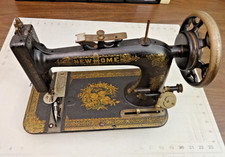 Antique Treadle Sewing Machine in Ornate Cast-Iron and Oak Cabinet — listing 2