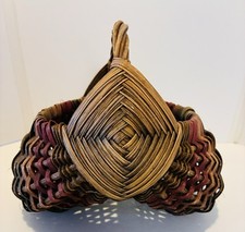 Vintage Handwoven Wicker Basket with Wrapped Handles and Striped Rim Detail — listing 4