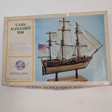 Display Case of Assorted Decorative Collectibles (Model Ship, Woven Baskets, Model Bicycle, Wooden Flute) — listing 5