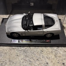 1953-1955 Chevrolet Corvette C1 Convertible 1:18 Scale Diecast Model in Harvest Gold/Yellow with Black Soft Top — listing 3