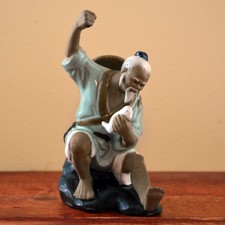 Chinese Shiwan (Mudman) Pottery Figure of a Seated Scholar with Fan