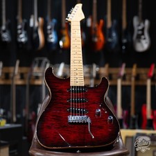 Suhr Electric Guitar (foreground headstock) with additional guitars on stand — listing 4