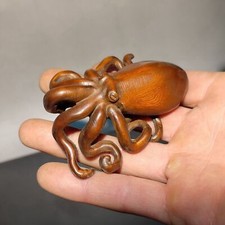 Carved Wood Object with Scrollwork Border and Dark Underside — listing 5