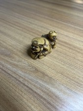 Japanese Carved Netsuke/Okimono Figure of a Child in Floral Kimono and Cap