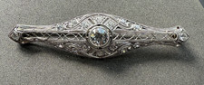 Art Deco Navette-Shaped Filigree Dinner Ring with Diamonds and Sapphire Calibre Halo
