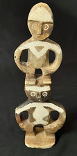 Carved Stone Figural Statuette of Seated Figure with Tall Headdress, Arms Crossed