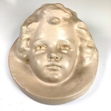 Cast Plaster Sculpture of a Seated Child Holding a Toy Car