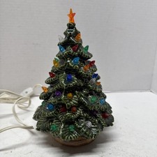 Ceramic Light-Up Christmas Tree with Train Base and Candy Cane Ornaments Yes - a paper sticker or brand name — listing 5