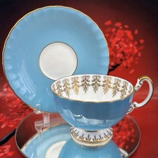 Porcelain Teacup and Saucer with Gold Scrolling Vine Pattern on Cream Ground — listing 4