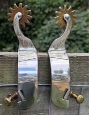 Pair of Vintage Hand-Engraved Western Riding Spurs with Silver-Toned Bands and Rowels — listing 4