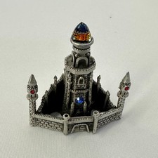 Pewter Castle/Tower Figurine with Faceted Crystal Point Spire Yes - there is text/logo on the bottom — listing 3
