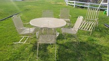 Vintage Wrought Iron Mesh Patio Dining Set - Round Table with 4 Springer Rocker Chairs and Red Cushions