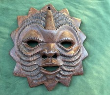 Hand-Carved Wooden Sun Face Wall Mask with Serene Green Face and Red Rays — listing 5