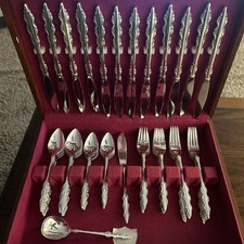 International Deep Silver Silverplate Sugar Shell Spoon with Ornate Scroll and Floral Handle