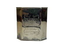 Set of 3 Decorative Embossed Metal Lidded Canisters with Footed Bases and Finial Lids — listing 3