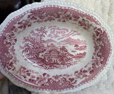 Ceramic item with red transfer-printed backstamp, maker unidentified (mark too blurred/smudged to read) — listing 6