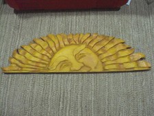 Hand-Carved Wooden Sun Face Wall Mask with Serene Green Face and Red Rays