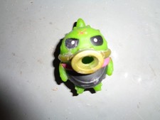 Green Egg-Shaped Monster Figure with Orange Arms and Legs — listing 3