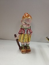 Pair of Mid-Century Ceramic Pouty Boy and Girl Figurines with Gold Trim