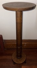 Antique Oak Oval Pedestal Dining Table with Carved Claw Feet and Pressed-Back Chairs