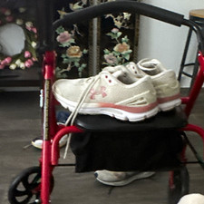 Blue Rollator Walker with Padded Seat, Wire Basket, and Hand Brakes