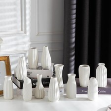 White Ceramic Bud Vase with Textured Pebble Pattern and Angled Rim — listing 3