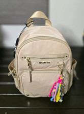 Black Nylon and Faux Leather Flap-Top Mini Backpack with Zip Front Pocket Yes - logo stamped on hardware/zippers — listing 5