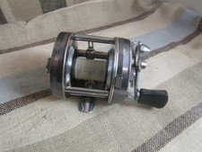 Vintage Copper-Finish Level-Wind Baitcasting Reel with White Handle Knobs — listing 5