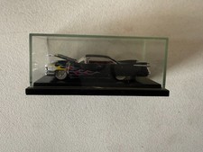 Hot Wheels Cadillac Seville Lowrider, Metalflake Maroon with White Pinstripe Panels