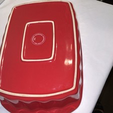 Ceramic item with red transfer-printed backstamp, maker unidentified (mark too blurred/smudged to read) — listing 2