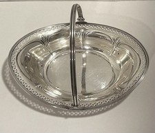 Antique Silverplate Pierced Bonbon / Sugar Sifter Spoon with Repoussé Floral Bowl Has a maker's name / symbol — listing 3