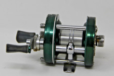 Vintage Copper-Finish Level-Wind Baitcasting Reel with White Handle Knobs — listing 3