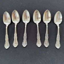 Set of 3 Ornate Silver-Plate Demitasse Teaspoons with Scrollwork Handles It's a name/logo I can't quite read