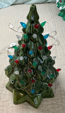 Ceramic Light-Up Christmas Tree with Train Base and Candy Cane Ornaments Yes - a paper sticker or brand name — listing 6