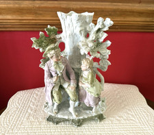 Porcelain figural spill vase with seated boy and rabbits, blue and white with hand-painted floral accents — listing 5