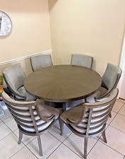 Rooms to Go 5-Piece Round Dining Set with Cast Metal Pedestal Table and Tufted Chairs