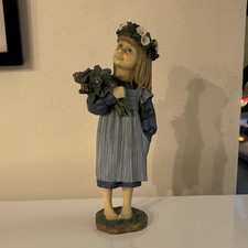 Resin Figurine of Young Girl in Red Dress Holding Doll and Quilt — listing 2