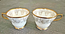 White Porcelain Footed Teacup with Embossed White Scrollwork Border and Platinum Trim — listing 4