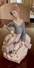 Lladró-Style Porcelain Figurine of Girl Lying Down Daydreaming on Wooden Base NAO by Lladró mark
