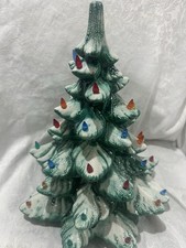 Ceramic Light-Up Christmas Tree with Train Base and Candy Cane Ornaments Yes - a paper sticker or brand name