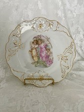 Set of Four Antique Hand-Painted Porcelain Cabinet Plates with Geometric Star & Rosette Motif