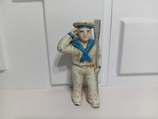 Cast Iron Nautical Lot: Sailor Still Bank, Mermaid Figure, and Pair of Ship Bookends