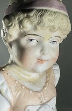 Antique German Bisque Porcelain Figurine of a Girl Holding a Bird