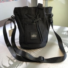 Small Black Nylon Crossbody Utility Pouch with Red/Black Stripe and Red Lining Yes - there is a printed label inside