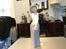 NAO by Lladró Porcelain Figurine - Girl Holding Birthday Cake with Puppy Dog, circa 1986