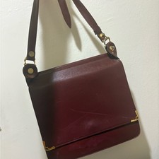 Cartier Sapphire Line Black Leather Crossbody Bag with Gold Chain Detail I'm considering buying from this listing — listing 4